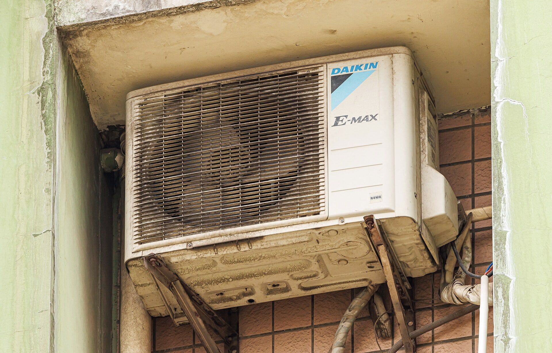 Daikin outdoor unit mounted on a wall bracket