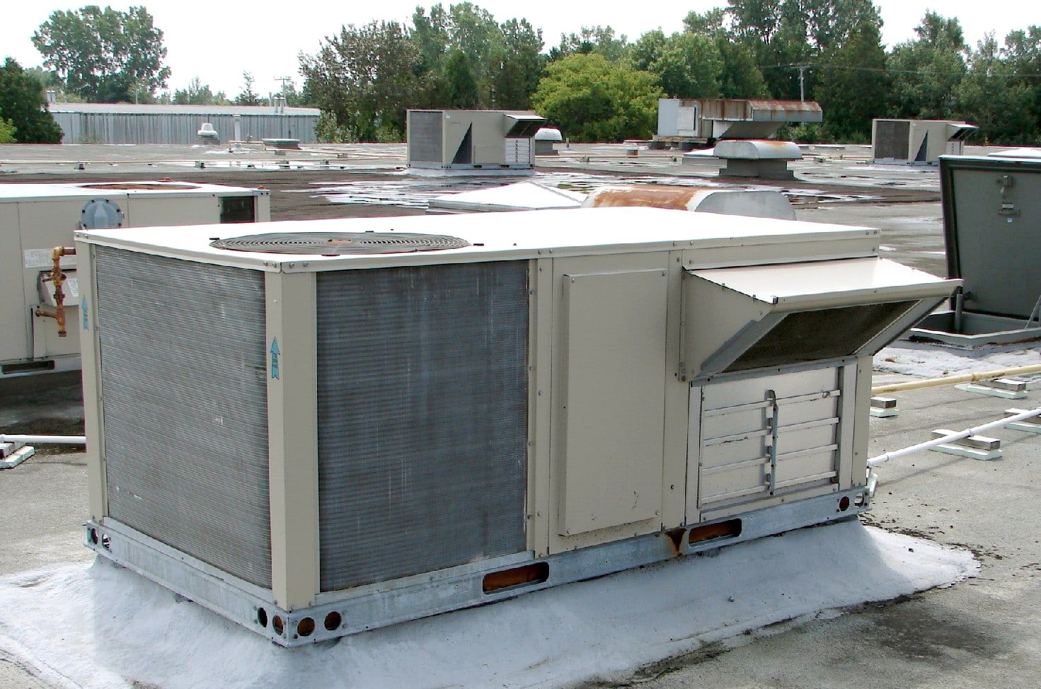 Packaged commercial air conditioning units on a flat roof