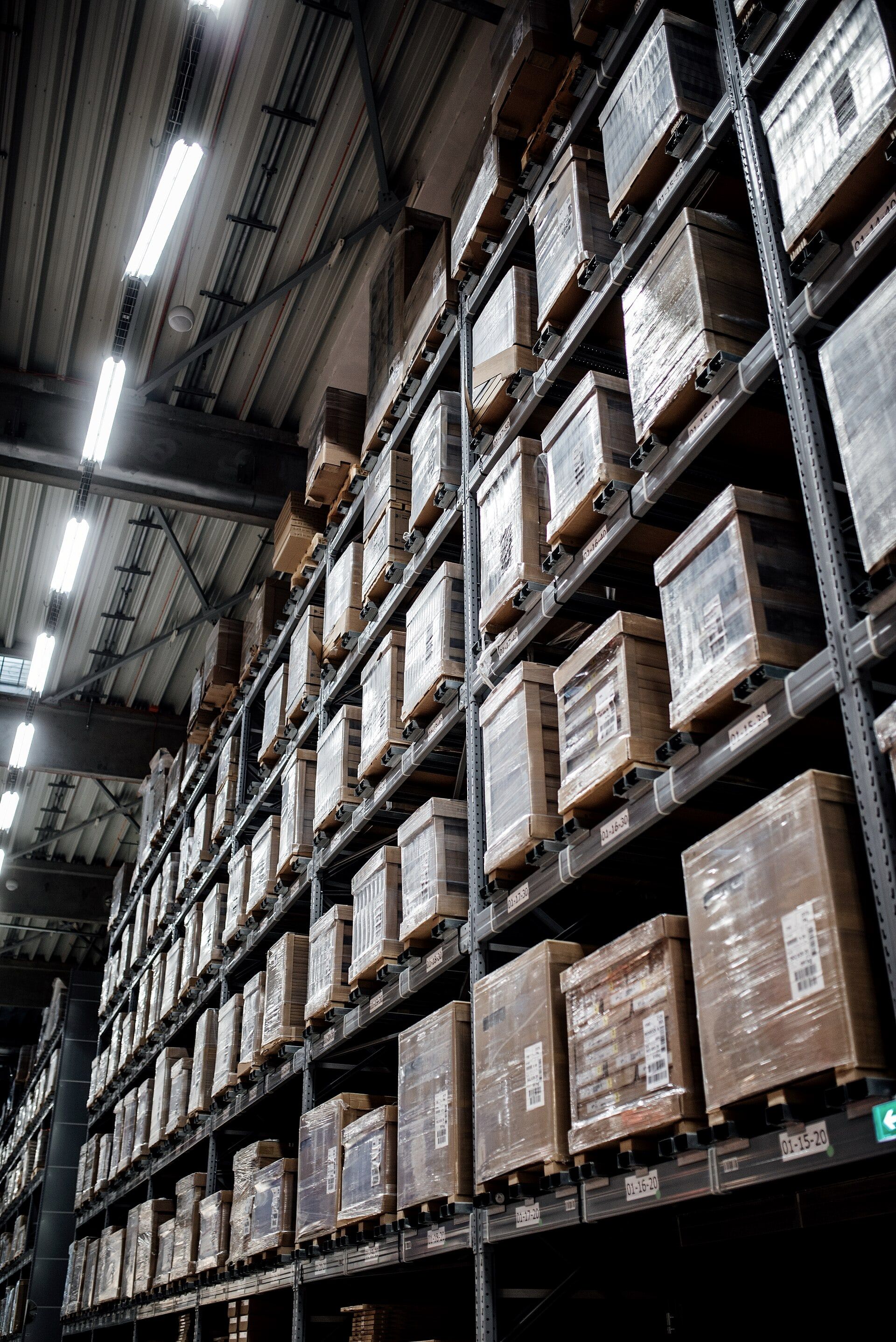 High-bay warehouse racks filled with boxed units